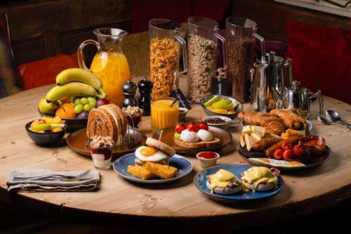 a table with many different types of breakfast foods at The George Inn in Warminster