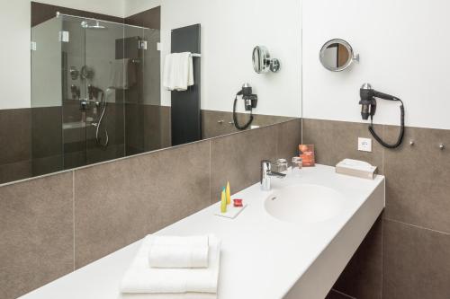 Koupelna v ubytování Stadthotel Reich