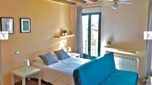 Ένα ή περισσότερα κρεβάτια σε δωμάτιο στο Apartamento en Plaza Mayor de Segovia
