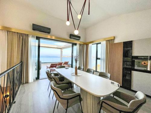 a dining room with a table and chairs at Apartment Villa Škoda by Interhome in Povljana
