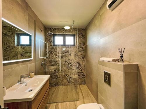 a bathroom with a sink and a toilet at Apartment Villa Škoda by Interhome in Povljana