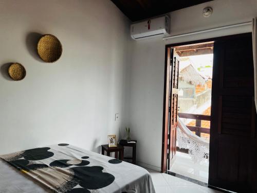 Postel nebo postele na pokoji v ubytování casa flamboyant- Apartamento com ar condicionado