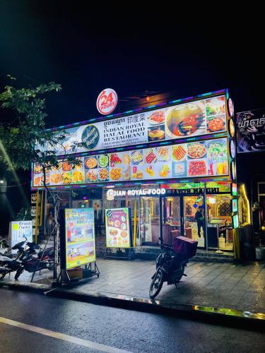 a building with a motorcycle parked in front of it at Sea inn guest house in Sihanoukville