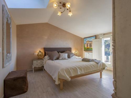a bedroom with a large bed and a window at Holiday Home Il Paradiso by Interhome in Massa e Cozzile