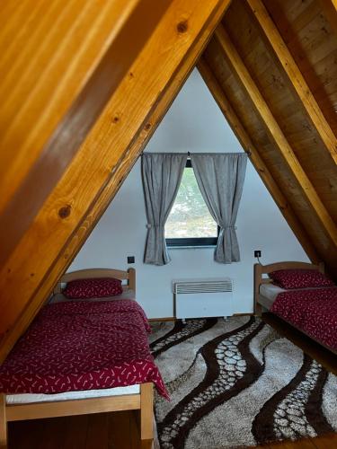 Postel nebo postele na pokoji v ubytování Vikendica Šumski mir Romanija