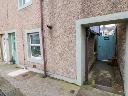 an entrance to a building with a blue door at Seahaven in Maryport