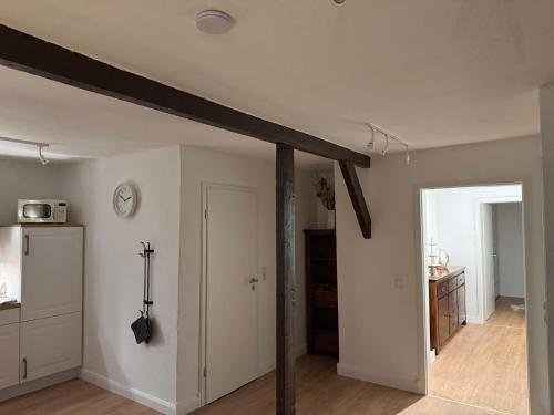 a living room with a wooden beam on the ceiling at Ferienwohnung Seegat in Emden