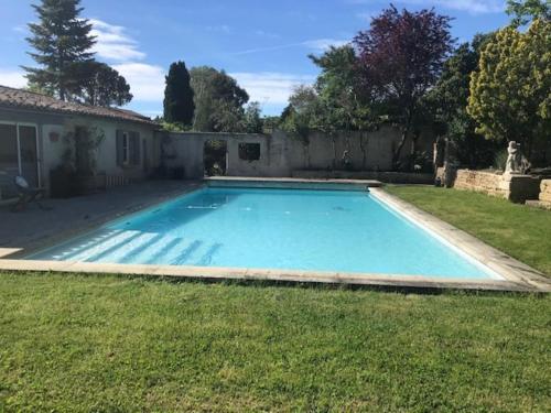 a swimming pool in the yard of a house at Terralha in Meynes