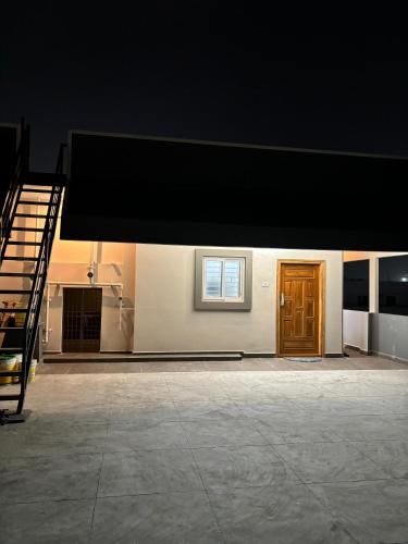a building with a black awning and a staircase at PS Elite Homestay in Tirupati