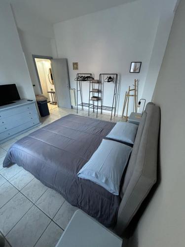 a bedroom with a large bed in a room at My Suite Fiuggi in Fiuggi