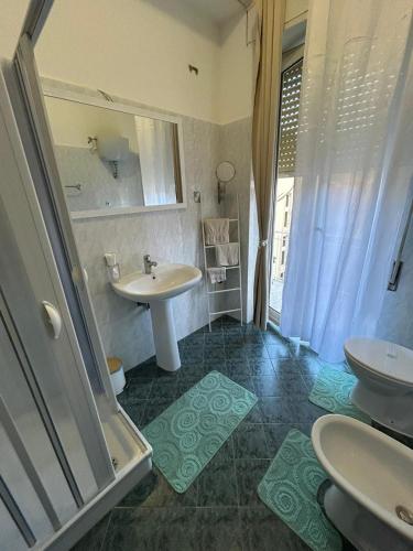 a bathroom with two sinks and a shower at My Suite Fiuggi in Fiuggi