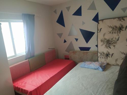 En eller flere senge i et værelse på Casa Village de Jacumã