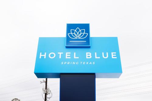 a sign for a hotel blue spring resorts at Hotel Blue Spring in Spring
