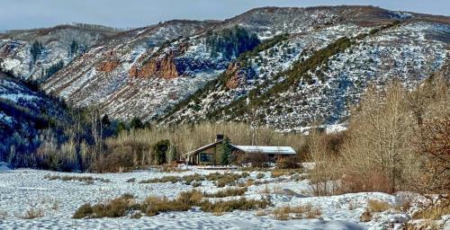 a cabin in the middle of a snow covered mountain at GrayRock in Eagle