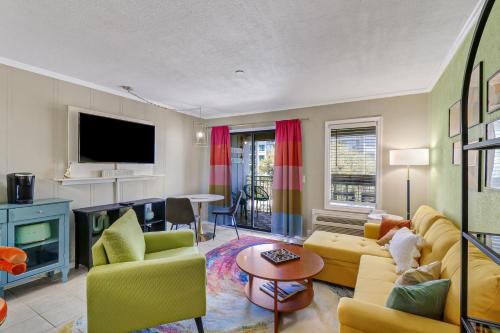 a living room with a couch and a tv at Ocean Views Retreat to Ocean Dunes Villa in Hilton Head Island