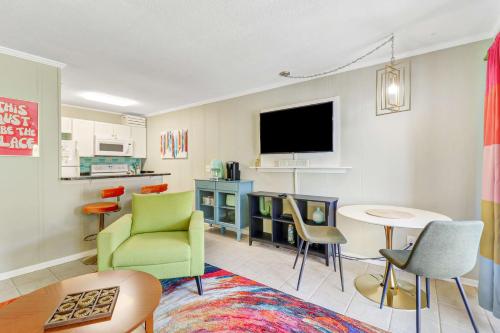 a living room with chairs and a table and a tv at Ocean Views Retreat to Ocean Dunes Villa in Hilton Head Island