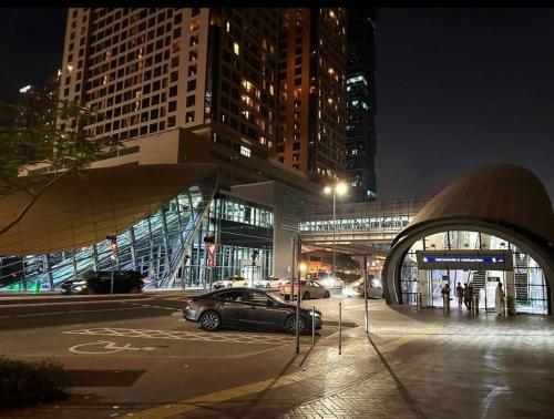 a car parked in a parking lot in a city at night at Center Point Partition Room in Tecom in Dubai