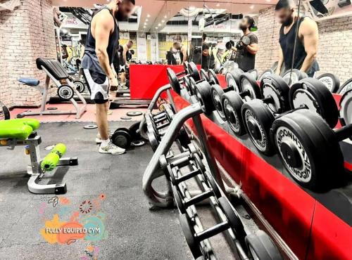 a group of men working out in a gym at Center Point Partition Room in Tecom in Dubai