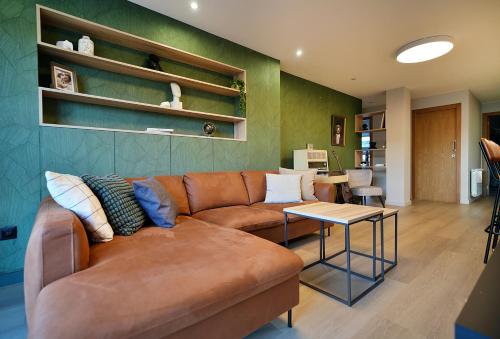 a living room with a couch and a table at GALIHOST - Apartamento con terraza en Vilagarcía de Arousa in Vilagarcia de Arousa