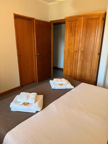 Ein Bett oder Betten in einem Zimmer der Unterkunft Hostería Bärenhaus