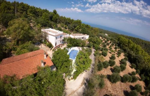 an aerial view of a house on a hill with a pool at Santa Lucia-Park Coppa della Nuvola in Peschici