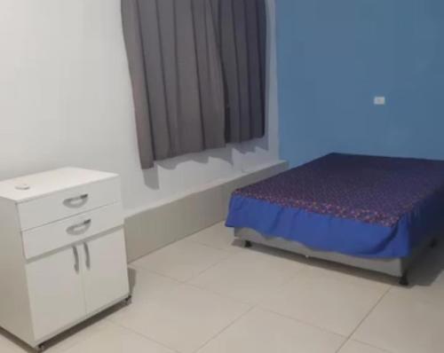 a bedroom with a bed and a dresser and a window at Marina's in Pau dʼAlho