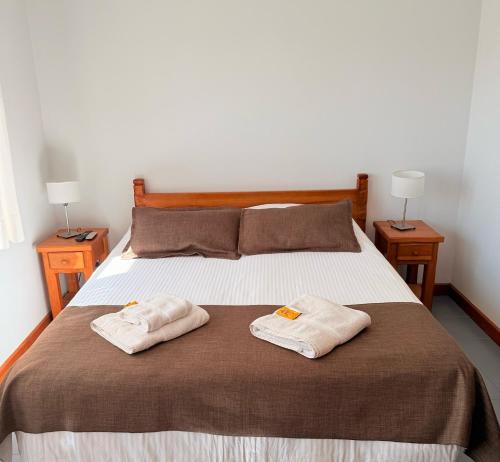 Ein Bett oder Betten in einem Zimmer der Unterkunft Hostería Bärenhaus