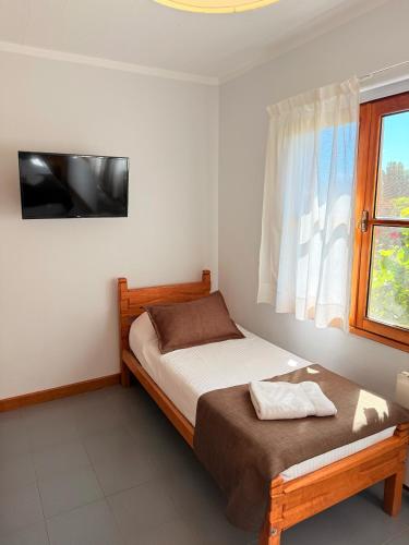 Ein Bett oder Betten in einem Zimmer der Unterkunft Hostería Bärenhaus