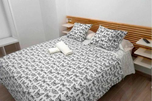 Centralmar Centro Superior Apartamentsにあるベッド