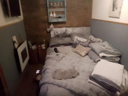 a bedroom with a bed covered in snow at The Stables in Gloucestershire