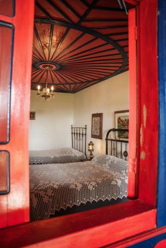 a view of a bedroom with two twin beds at Finca Hotel in Armenia