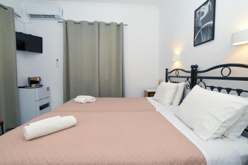 Postel nebo postele na pokoji v ubytování Asteri Hotel