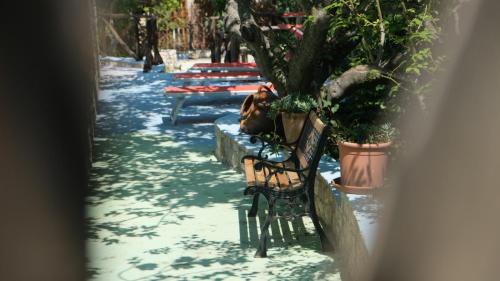 a person sitting on a bench in the snow at Santa Lucia-Park Coppa della Nuvola in Peschici