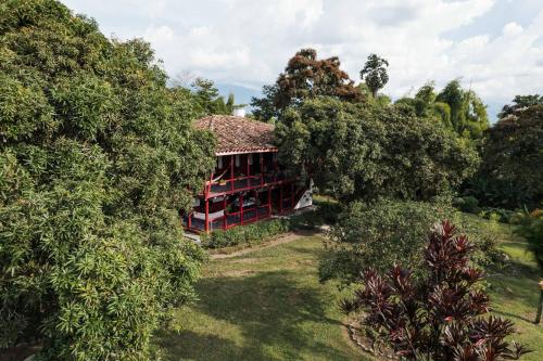 an aerial view of a house surrounded by trees at Finca Hotel in Armenia
