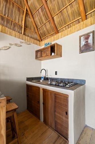 a kitchen with a sink and a counter top at Panchos Paradise in Puerto Vallarta