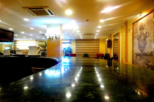 a lobby with a bar in a hotel at Hotel Orizzonte in Letojanni