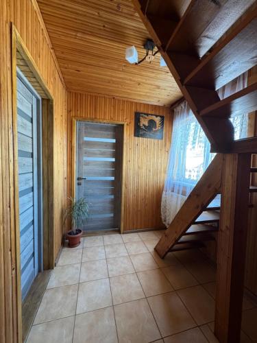 a hallway of a house with a wooden ceiling at HOUSE Mold in Lazeshchyna
