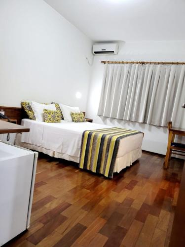 Ένα ή περισσότερα κρεβάτια σε δωμάτιο στο Hotel Giordano Centro