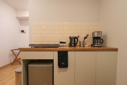 a kitchen with a counter with a coffee maker on it at Casa Muru By Wynwood House in Cusco