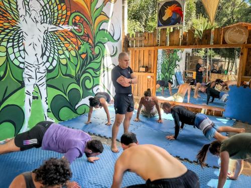 a group of people doing yoga in a room at Unicorn Reborn - Peaceful Rentals in San Marcos La Laguna