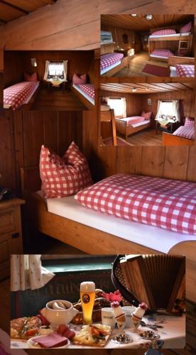 a room with two bunk beds and a table at Bründling-Alm Berggasthof auf 1167m auf dem Hochfelln in Bergen
