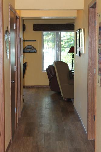 a living room with a couch and a window at Unit 102, 2 Bedroom Duck Lake Condo in Eagle River
