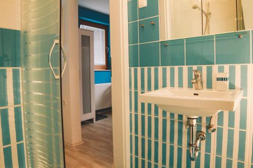 a bathroom with a sink and a mirror at Apartments Sasha in Bled