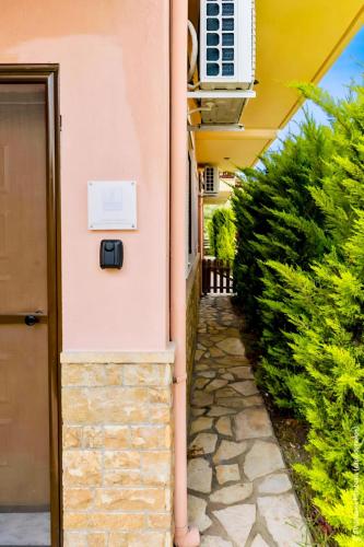 a house with a mailbox on the side of it at khouse - Personal Paradise in Neos Marmaras