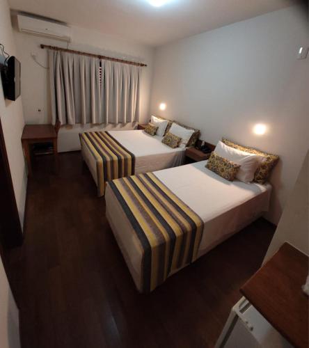 Ένα ή περισσότερα κρεβάτια σε δωμάτιο στο Hotel Giordano Centro