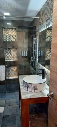 a bathroom with a round tub on a counter at Hotel Boutique Guatika in Tibasosa