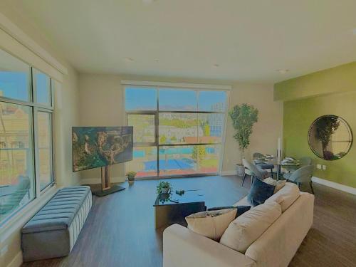 a living room with a couch and a table at Hollywood Sign View 2 Bed 2 Bath Premium Corner in Los Angeles