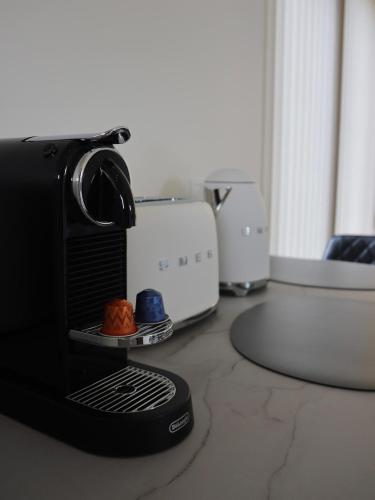 a camera sitting on top of a counter with food at Lyngborgir cabin in Minni-Borg