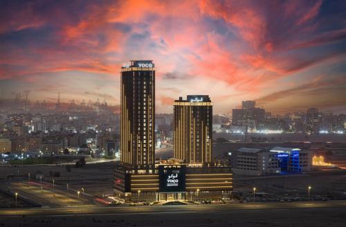 a view of a city at night at voco Jeddah Gate by IHG in Jeddah