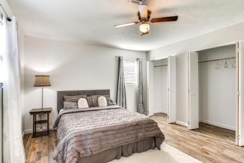 a bedroom with a bed and a ceiling fan at 6 Mi to The Masters Updated Home with Yard! in Augusta